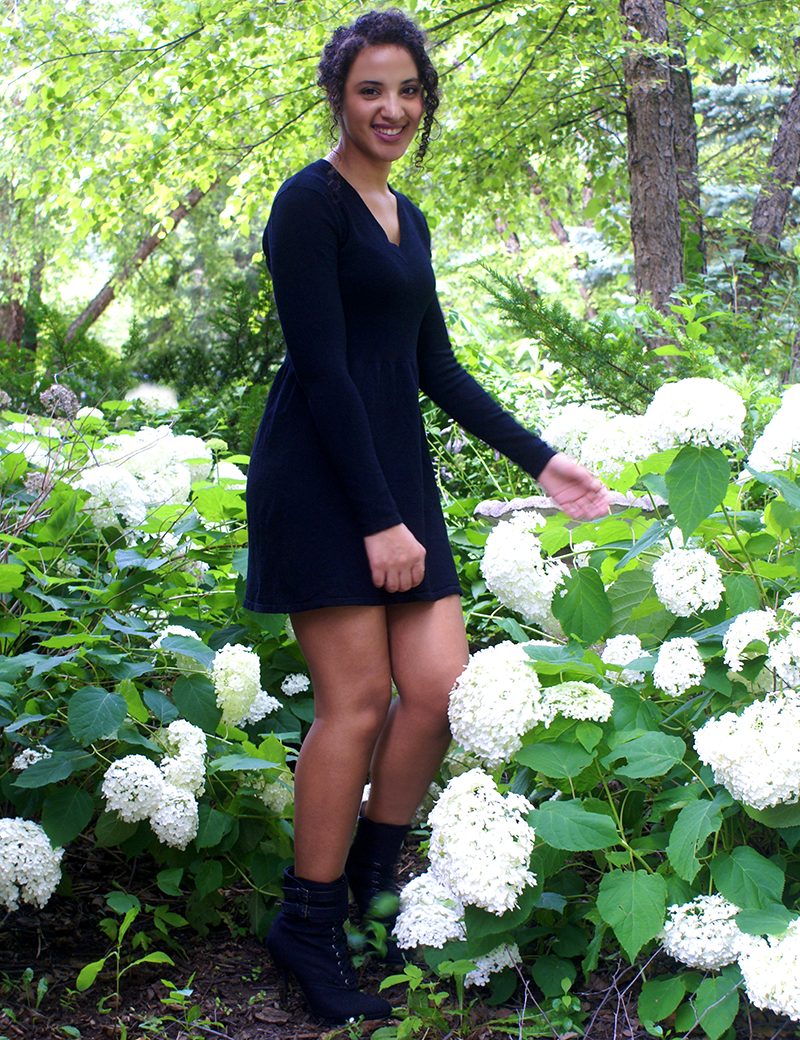 Girl in black knit dress, mini-length