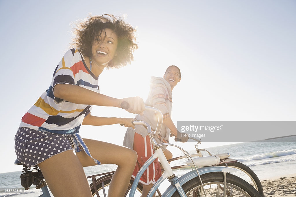 Man and woman riding bicycles. Photo Credit: Hero Images - 468775815. gettyimages.com