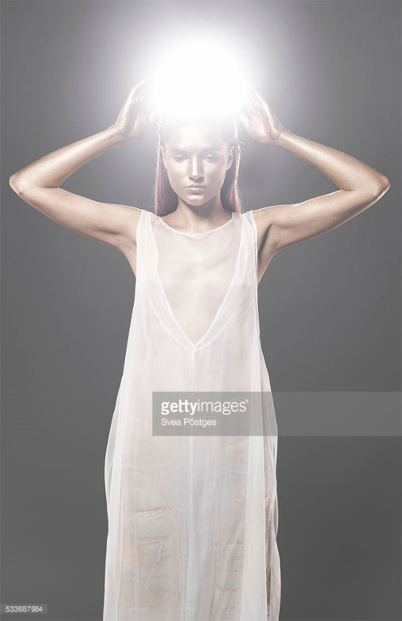 Woman with glowing orb lifted above her head. Photo Credit: Svea Postges - 533687984. gettyimages.com. Published via Alwaysuttori.com. The INTJ Mastermind Series Part 1: The Mastermind Mindset